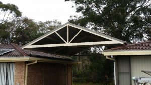 Gable flyover roof carport with decorative spokes from Judds Garages