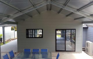 Double garage with single 5-metre roller door and rear room