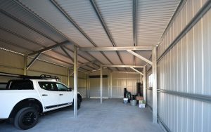 Interior framework of a double monopitch garage at Windella, with K-Panel wall cladding and corrugated roof cladding