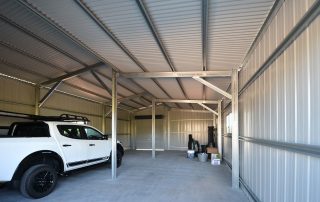 Interior framework of a double monopitch garage at Windella, with K-Panel wall cladding and corrugated roof cladding